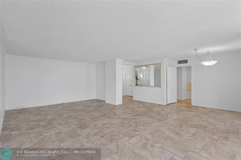 Virtually staged living and dining area.