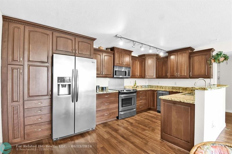 Custom Open Kitchen with Stainless Steel Appliances