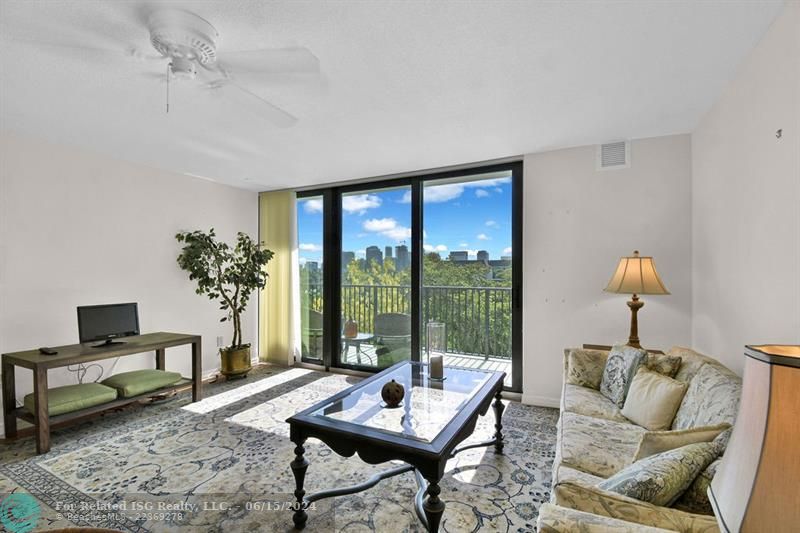 Living Room with new Impact Glass Doors to Balcony