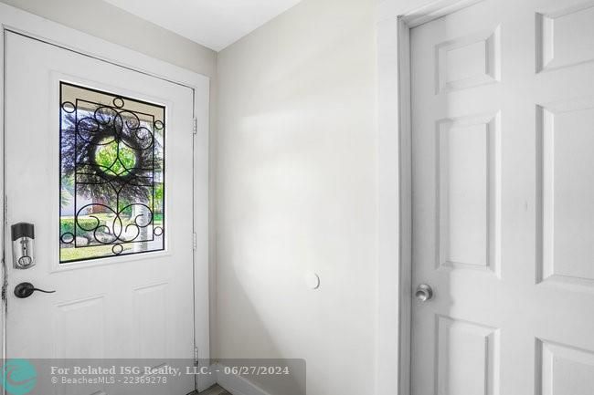 Inside front door and entry to fourth bedroom