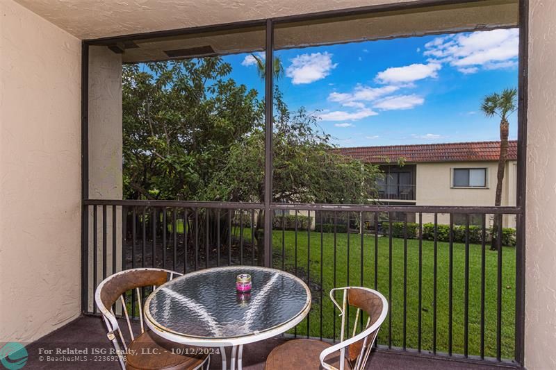 Screened in balcony overlooking garden area