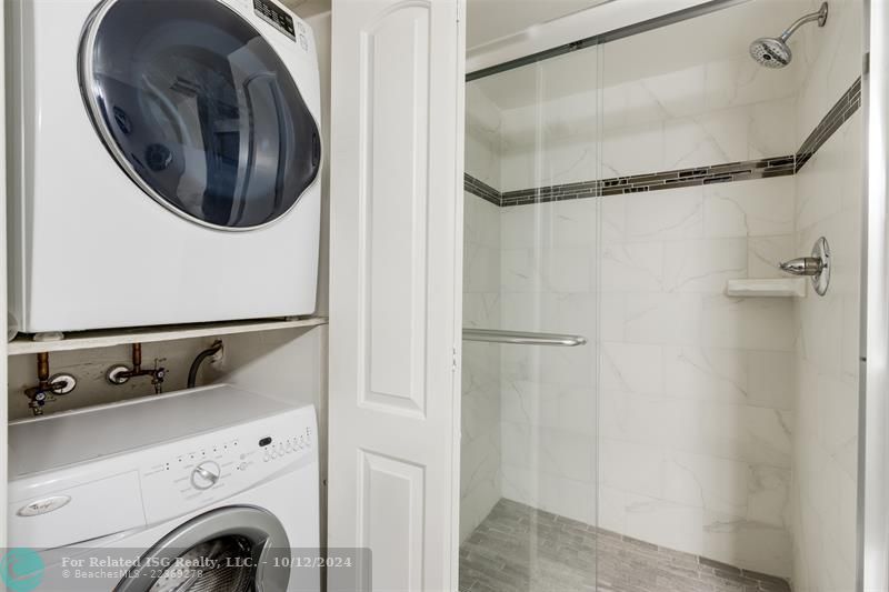 Guest bathroom with washer and dryer