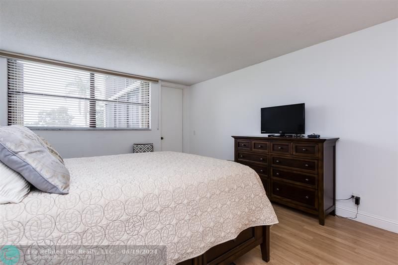 Large Queen Bed with built-in drawers for storage.  Matching Dresser