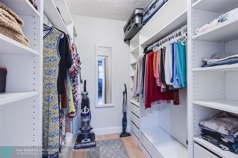 Custom Built-in very large walk-in closet in the Master bedroom with plenty of storage here. One of three closets located in the master bedroom suite.