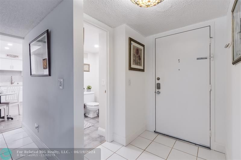 Foyer entrance to your condo with the powder room (1/2 bath)