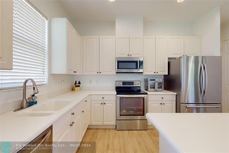 LIGHT BRIGHT WHITE kitchen with SS appliances