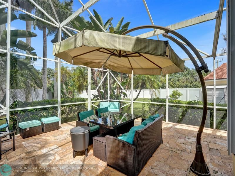 screened patio area with travertine floor