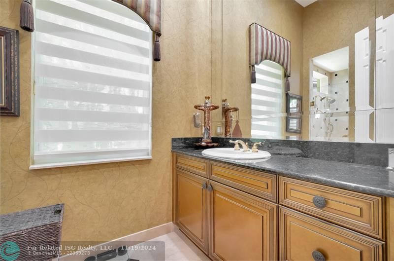 The Elegantly Designed Master Bathroom Features His & Hers Split Quarters! This is His Private Bathroom Area!