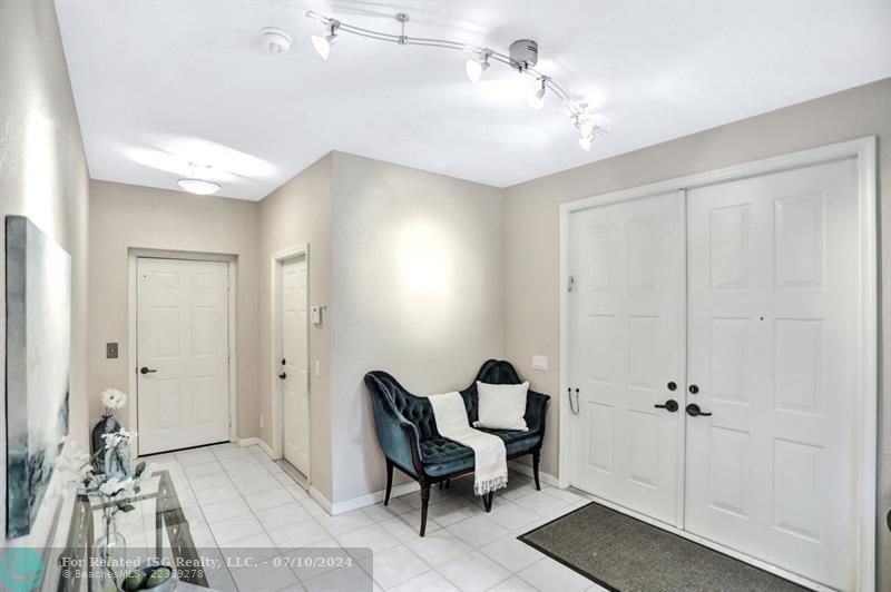 Double door entry opens to the spacious foyer, with private elevator to 2nd level.