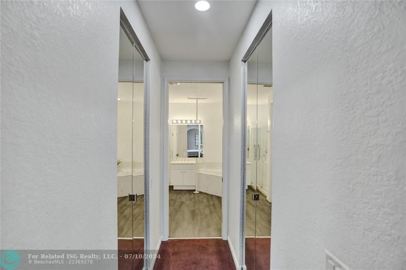 Passageway from bathroom to master suite, large double walk-in closets.