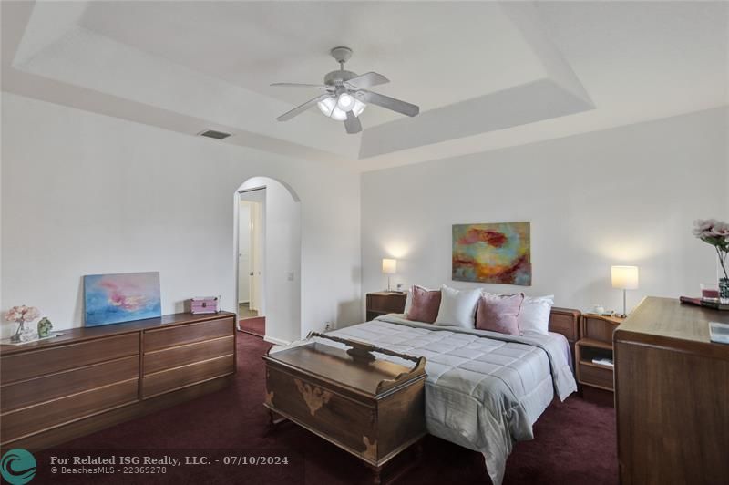 Coffered ceiling, ceiling fan, double walk in closets.