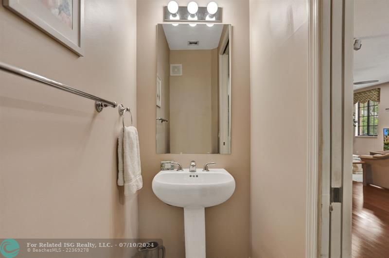 Half bathroom with pedestal sink for your guests!