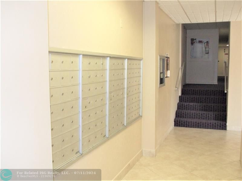 In the Lobby just outside of the Elevators are the mailboxes.