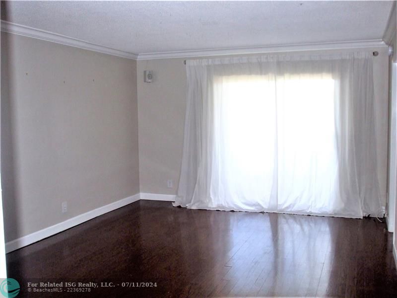 The beautiful wood floors are throughout the unit.