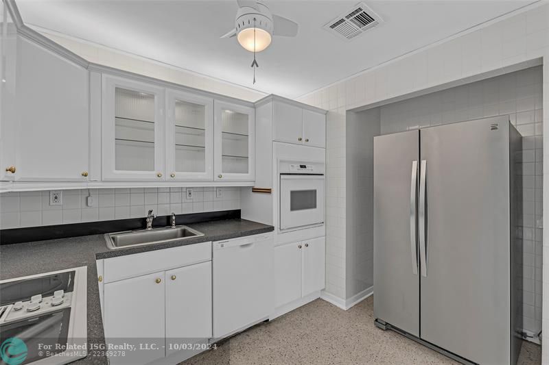 Kitchen with view to large carport