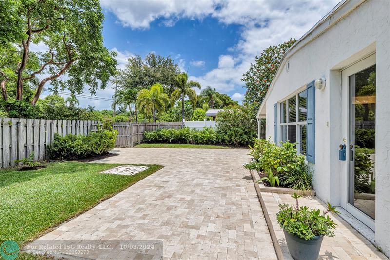 Large travertine patio and yard