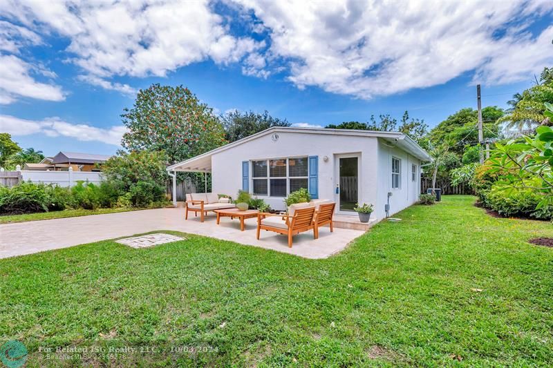 Large front yard and virtually staged travertine patio