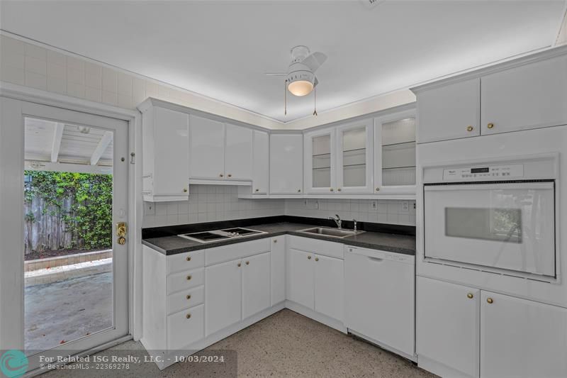 Kitchen with view to large carport