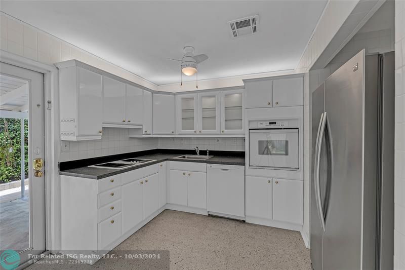 Kitchen with view to large carport