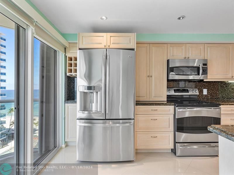 KITCHEN WITH SLIDING DOORS TO THE BALCONY