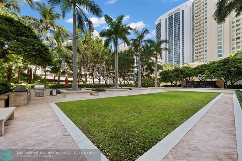 Garden area /barbeque grills on pool deck perfect for entertaining