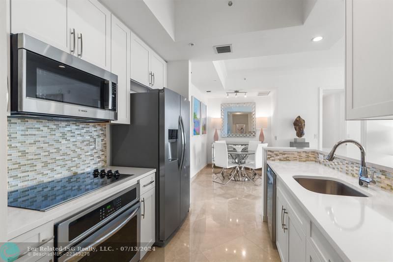 New modern white cabinetry and quartz countertops