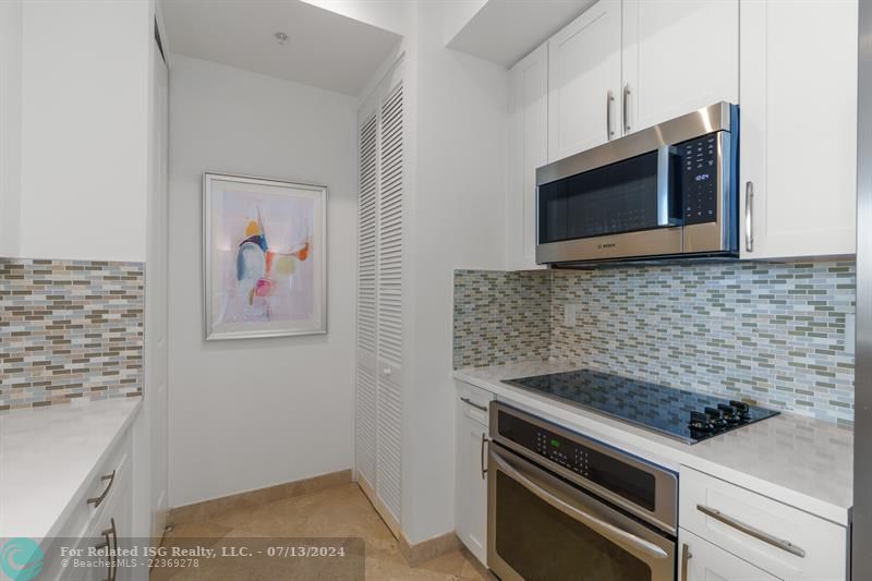 New S/S appliances-pantry closet on left and W/D behind the doors on right