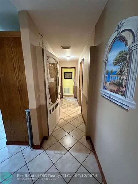 Hall leading into laundry room and Den/Hobby room