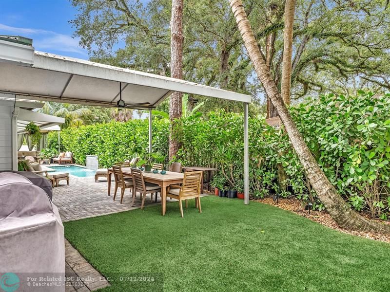 Large outdoor dining area and astro turf