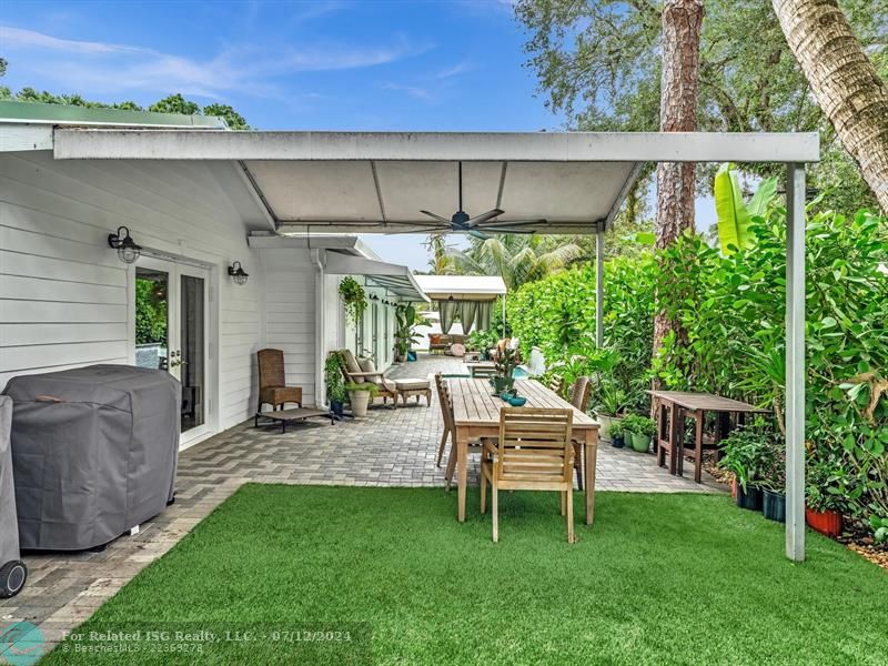 Large outdoor dining area and astro turf