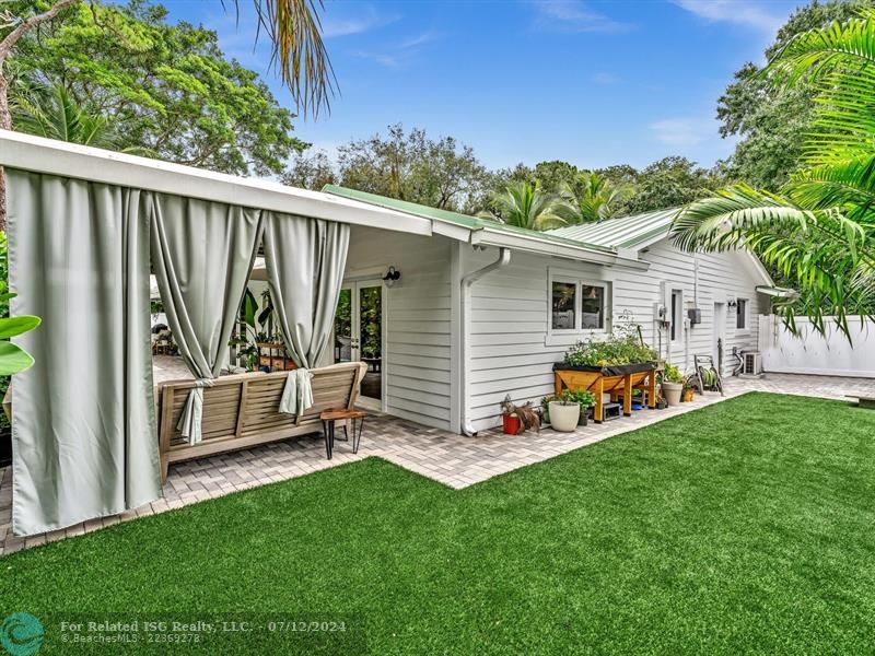 Serene seating areas throughout secluded yard.