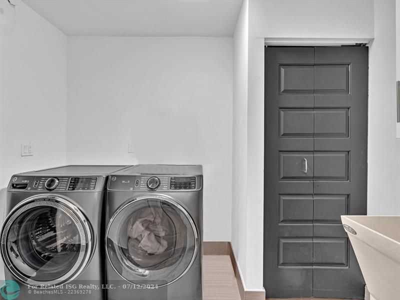 New Front loading Washer and Dryer and Sink in Laundry room