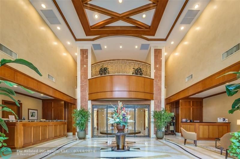 2 story lobby with desk attendant, security & concierge