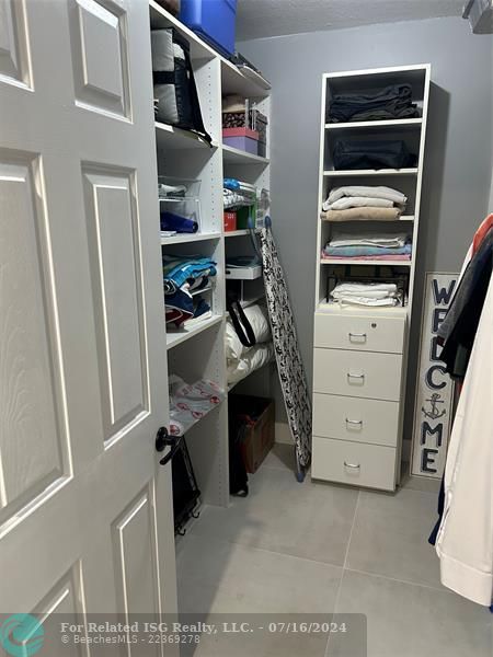 Guest walk-in closet with built-ins