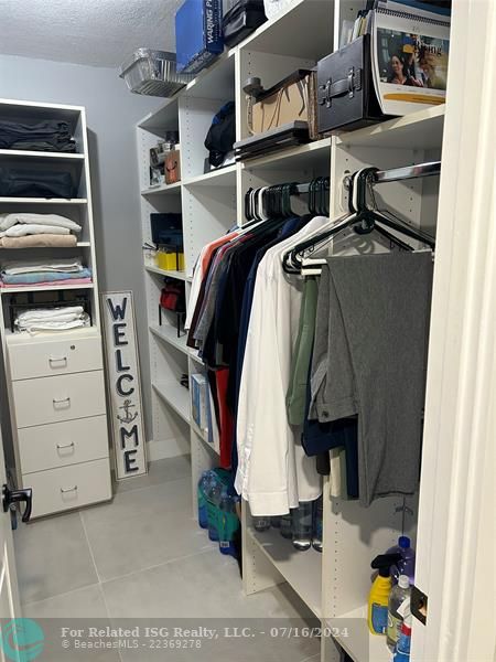 Guest walk-in closet with built-ins