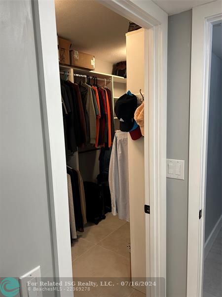 Primary bedroom walk-in closet entry