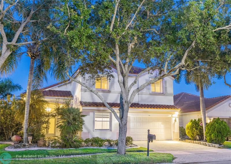 Situated at the edge of a culdesac on one of Weston's widest lakes, this beautifully maintained residence boasts a brand new 2024 ROOF and full accordion shutters.