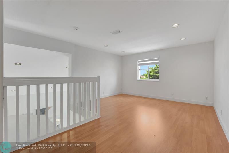 As you come upstairs, you'll see this spacious loft area, which was Builders option for the 5th Bedroom, hence listed as a 5 Bedroom home in the tax records; easy to convert to a 5th bedroom!