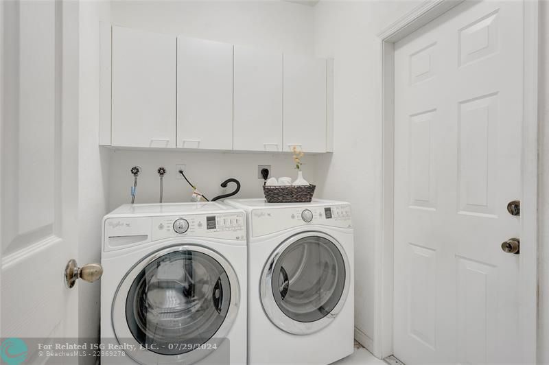 Washer and dryer are like new, with cabinetry. (Sink in garage).