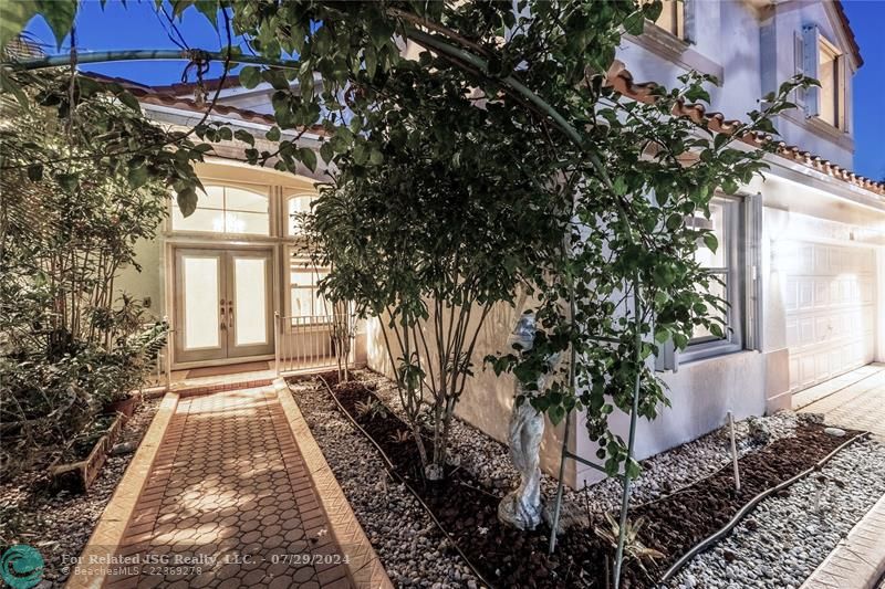 An organic archway of foliage to welcome you home.