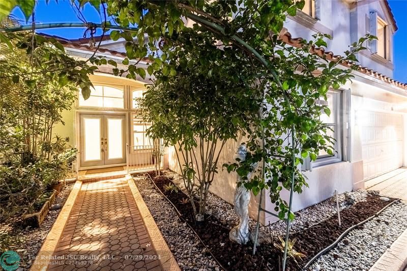 An organic archway of foliage to welcome you home.