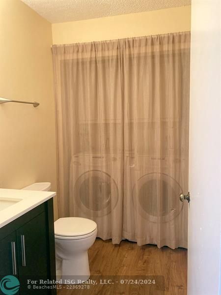 Convenient half bath with laundry downstairs