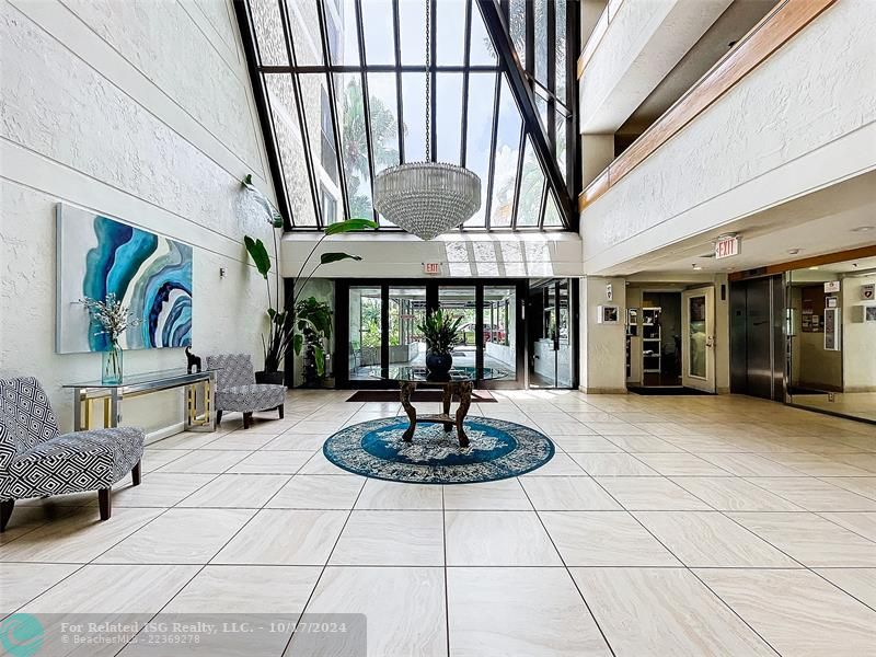 Modern, light and bright lobby with elevator on right