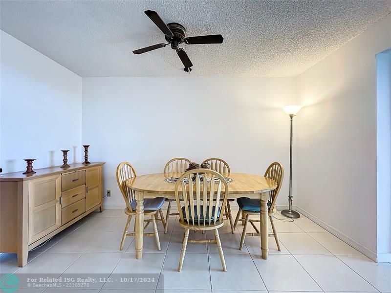 White kitchen with new stove, disposal, microwave, refrigerator