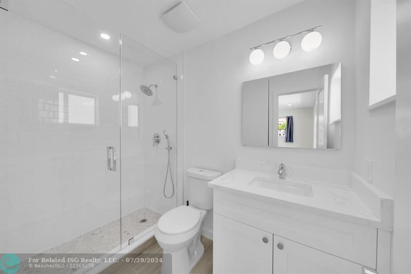 Primary bath with gorgeous custom shower.