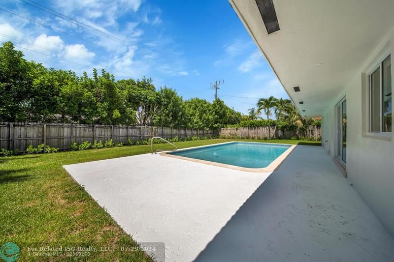 Large patio area for family gathering and barbecuing.