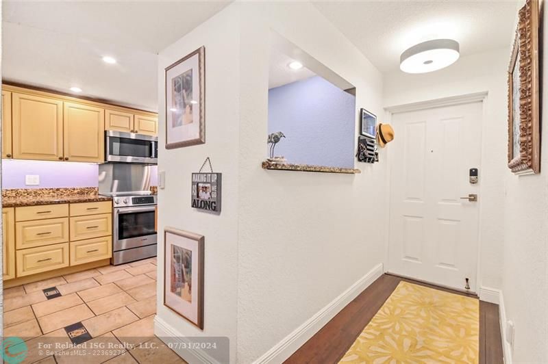 Entry facing front door w/kitchen view