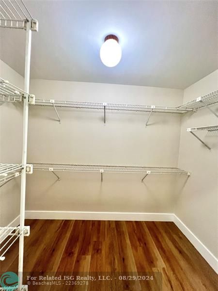 Primary bedroom walk-in closet