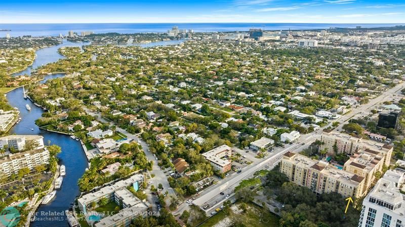 Walking area surrounding condo.  Yellow arrow on right side of photo points to unit facing north looking towards New River.