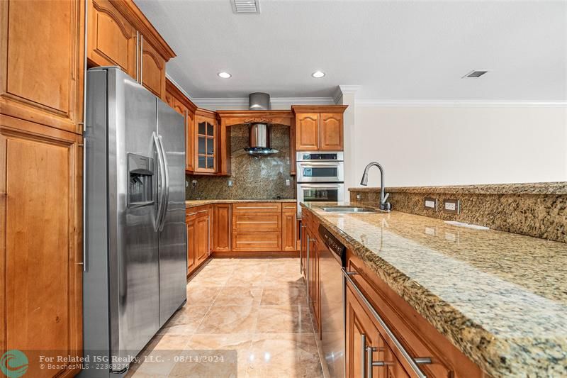 Kitchen with all stainless appliances and plenty of  cabinetry.